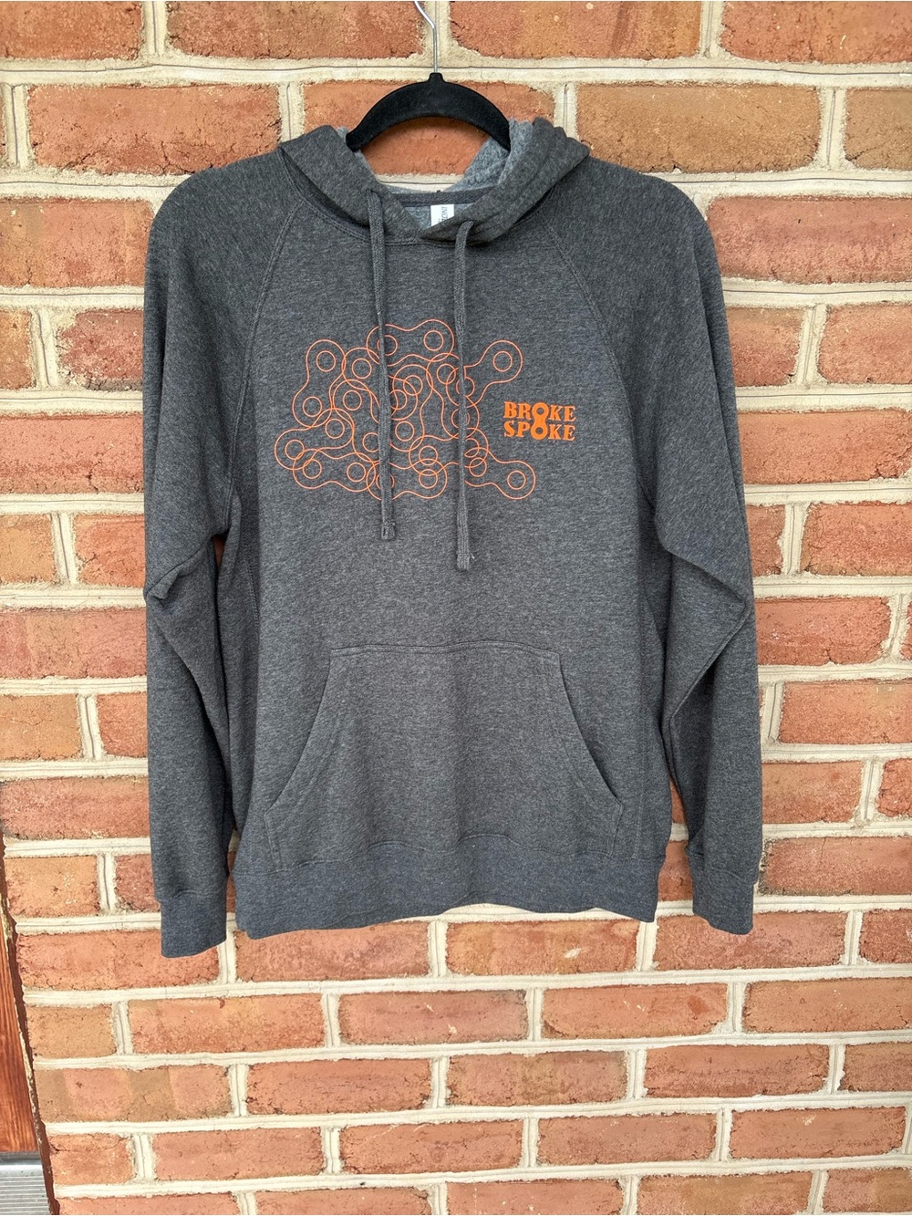 Men's Charcoal Gray Hoodie with Orange Logo. Broke Spoke